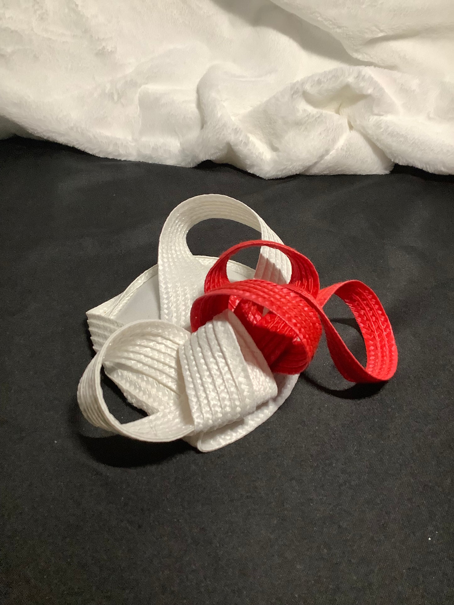 "Ribbon Twist 2025" – Crimson Edge Fascinator